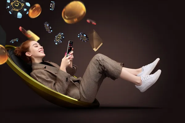 A player using their smartphone during a festive local event, representing CHAMBAWINPH’s fully mobile-friendly casino.